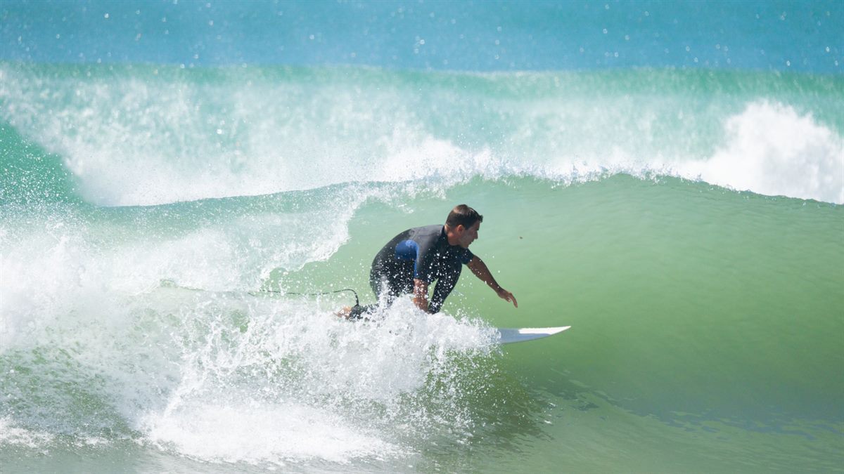 A surfer riding a wave on Morocco's Atlantic coast