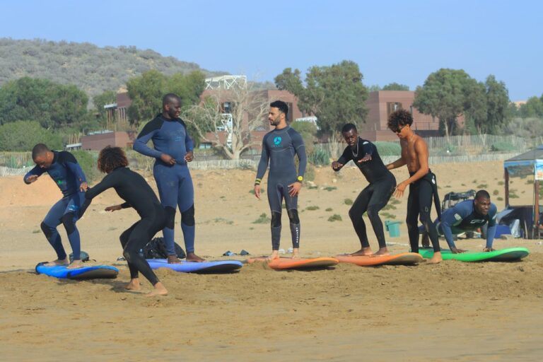 Group surf briefing and pop-up practice on the sand in Taghazout